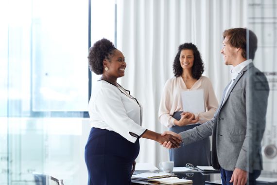 Man and woman shaking hands